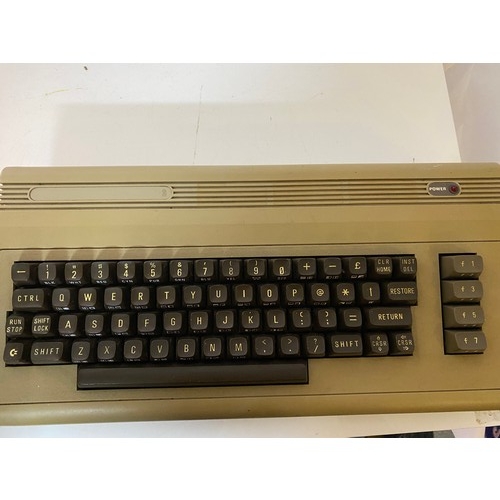 633 - A vintage Commodore 64 with selection of games and monitor