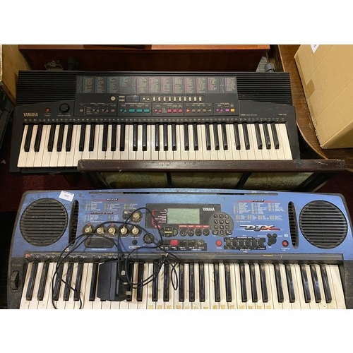 666 - A Yamaha PSR-215 keyboard and a Yamaha portatone PSR-D1 keyboard. Both working, only 1 power lead