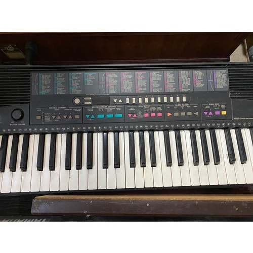 666 - A Yamaha PSR-215 keyboard and a Yamaha portatone PSR-D1 keyboard. Both working, only 1 power lead