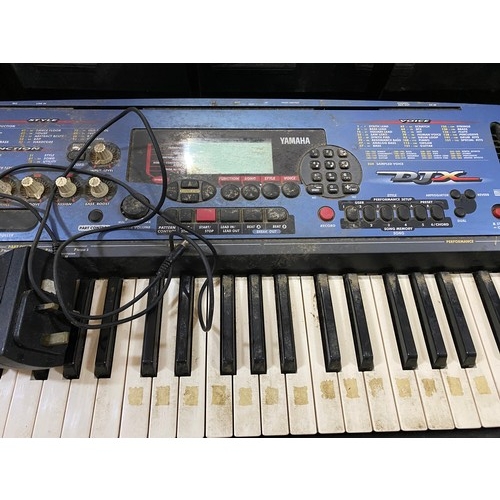 666 - A Yamaha PSR-215 keyboard and a Yamaha portatone PSR-D1 keyboard. Both working, only 1 power lead