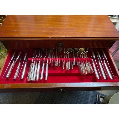 779 - Silver plate cutlery set in a 3 drawer display unit standing 59 x 72cms tall