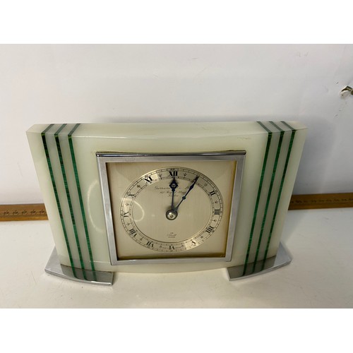 713 - An Elliot clock from Gerrard & Co Ltd in marble and chrome. Has been over wound.