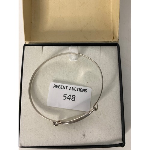 548 - Sterling silver bangle with decorative stone.