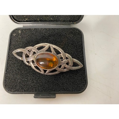 518 - Sterling silver and amber brooch