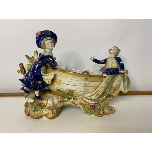 109 - A Victorian Bisque spill holder/planter and 3 x Goebel figures. 24x17cms