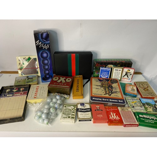 215 - Assortment of vintage playing cards and games.