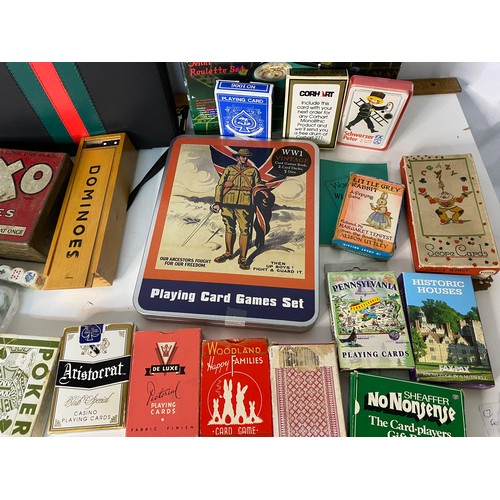 215 - Assortment of vintage playing cards and games.