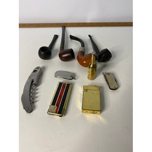 3 - Selection of tobacciana including pipes, lighters and penknives.