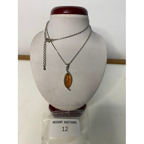 12 - Sterling Silver and Amber pendant on Sterling Silver chain.