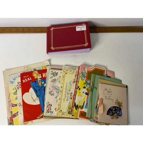 35 - Postcard album of greetings postcards and bundle of greetings cards.