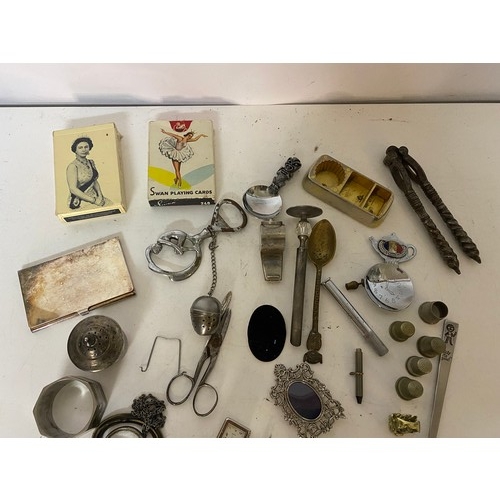 Box of assorted curios, including nut crackers, spoons, thimbles and