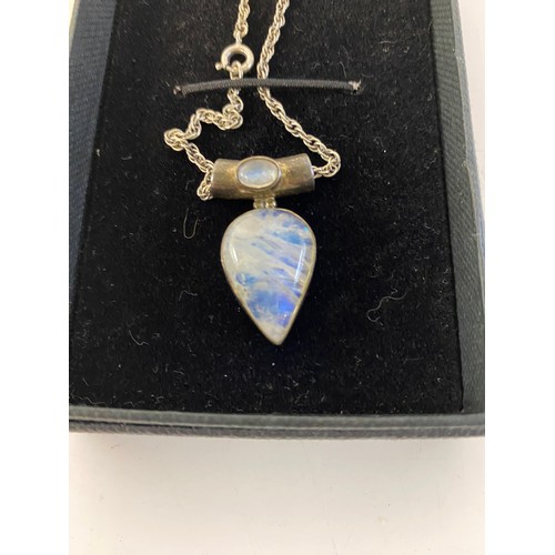 526 - Rainbow moonstone pendant set in silver on silver chain.