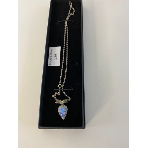 526 - Rainbow moonstone pendant set in silver on silver chain.