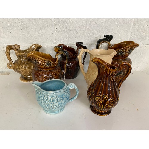 779 - Collection of 7 x water jugs, mainly Arthur Wood