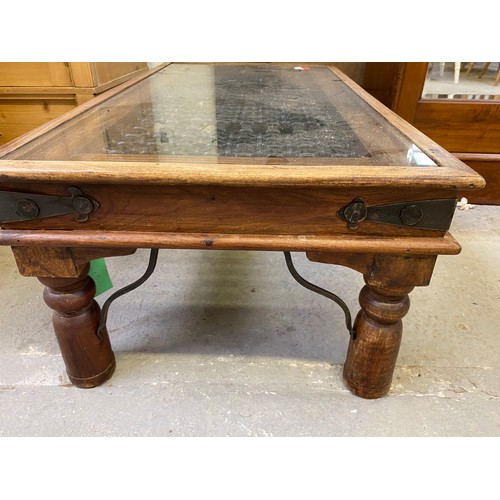 791 - Metal and wood coffee table with glass top measuring 110 x 60 x 40 cms tall