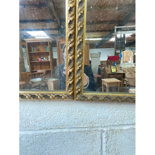 801 - Pair of mirrors with gold frames measuring 50 x 60 cms