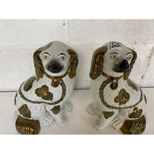 820 - Pair of mantle dogs measuring 24 cms tall