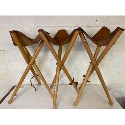 833 - 3 x tripod folding stools with leather seat