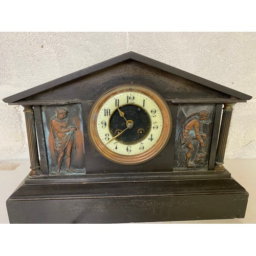 835 - A John Taylor slate/marble mantle clock with key, believed to be working, slight damage