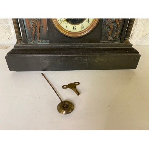 835 - A John Taylor slate/marble mantle clock with key, believed to be working, slight damage