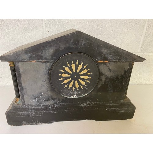 835 - A John Taylor slate/marble mantle clock with key, believed to be working, slight damage