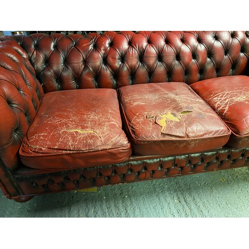 871 - Oxblood red chesterfield 3 seater measuring 198 cms wide