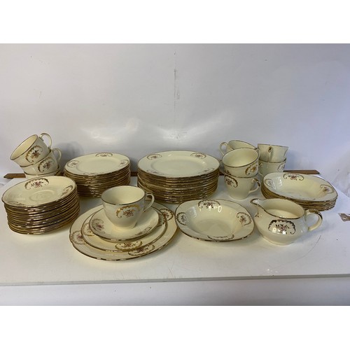 640 - 58 piece Alfred Meakin dinnerware in cream and gold.