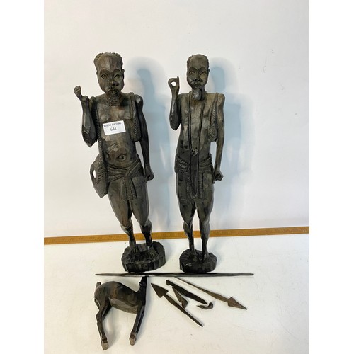 641 - Pair of African carved tribal hunter figures, measuring 49 cm tall.