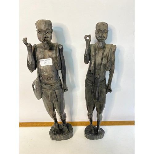 641 - Pair of African carved tribal hunter figures, measuring 49 cm tall.