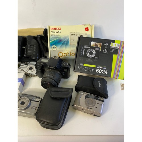 661 - Selection of cameras and accessories to include Pentax Espio 7389, Canon Eos 1000F and 2 pair of bin... 