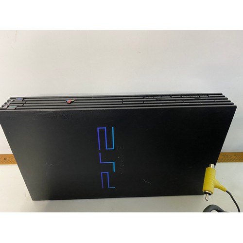 684 - Original PS2 console with controllers, racing wheel, Namco light gun and 10 games. Tested and workin... 