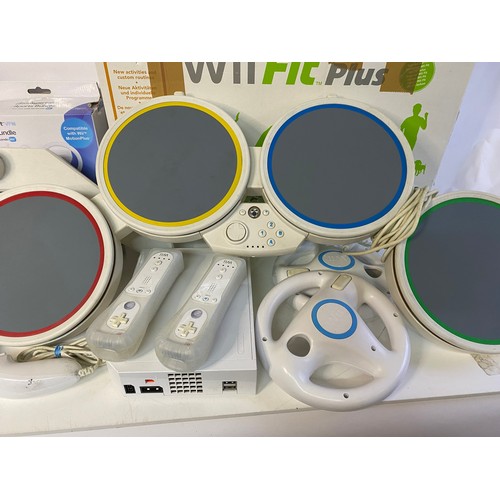 685 - Nintendo Wii console with controllers, nunchucks, sports pack, fit board, rock band drums and 16 gam... 