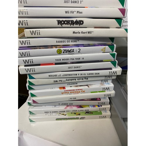 685 - Nintendo Wii console with controllers, nunchucks, sports pack, fit board, rock band drums and 16 gam... 