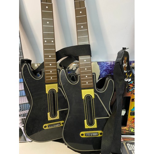 686 - 5 various gaming guitars for different consoles and guitar hero games.