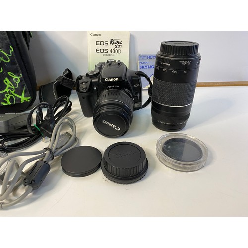 705 - Canon EOS 400d digital SLR camera with lenses, filters, battery charger and others. In working order... 