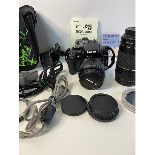 705 - Canon EOS 400d digital SLR camera with lenses, filters, battery charger and others. In working order... 