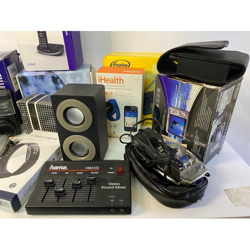 715 - Box of assorted small electricals including camera, fitbit, phones and radio.