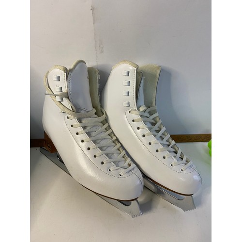 718 - Pair of Risport ice skates with carry case and guards, size medium.