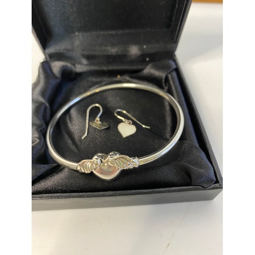 727 - Pandora silver winged heart bangle and a pair of heart ear-rings.