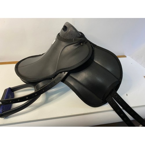 763 - Selection of new Equestrian goods including Headcollars, Fetlock Boots, a Saddle and other items.