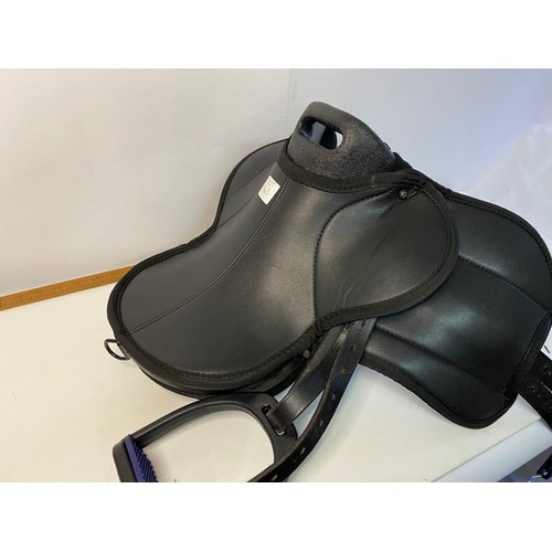 763 - Selection of new Equestrian goods including Headcollars, Fetlock Boots, a Saddle and other items.