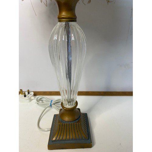 775 - Pair of glass column table lamps with fringed shades, in working order, measuring 57 cm tall.