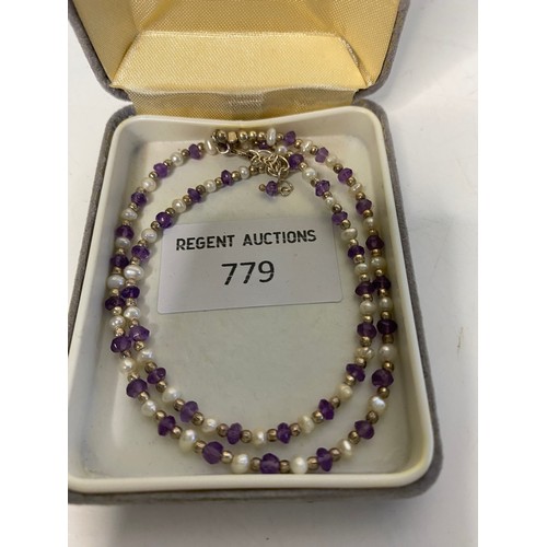 779 - Freshwater pearl and Amethyst glass necklace with 925 silver clasp and fitting.