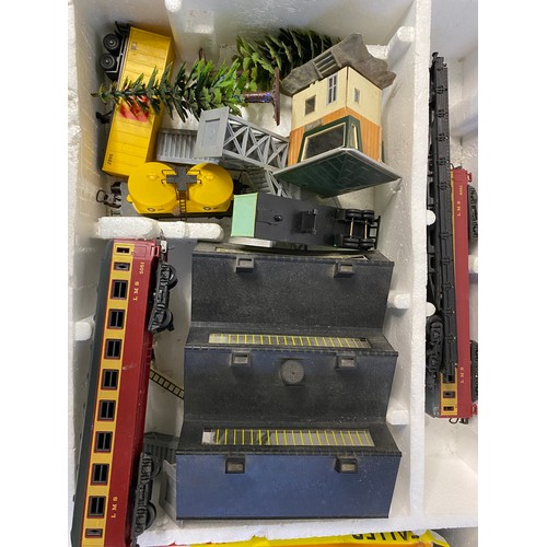 825 - Boxed Lima train set including trains, track, swing bridge and unloading containers