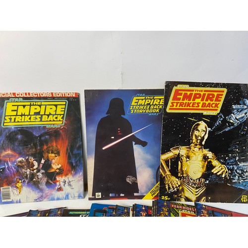 826 - 21 x 1980 'Empire Strikes Back' weekly comics by Marvel. Also, 2 x official posters monthly, sticker... 