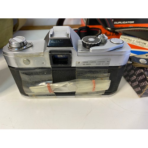 842 - Vintage Canon FT QL camera in bag with accessories including zoom slide duplicator, lens, mount and ... 