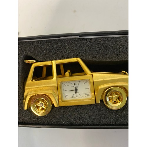 871 - W Widdop quartz miniature clock bus and jeep in gold