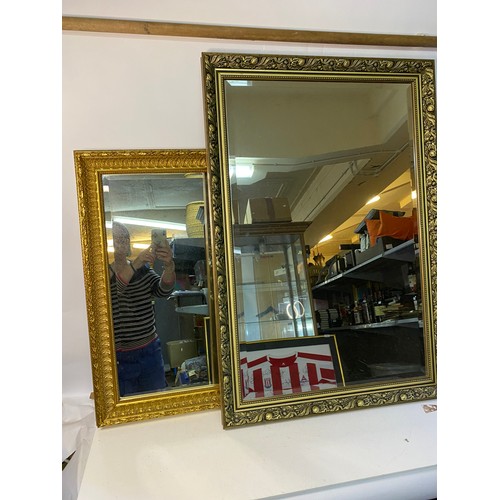 875 - 2 x ornate gold framed bevelled mirrors, one measuring 96 x 66 cms and one measuring 72 x 58 cms