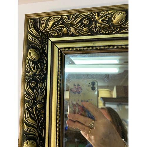 875 - 2 x ornate gold framed bevelled mirrors, one measuring 96 x 66 cms and one measuring 72 x 58 cms