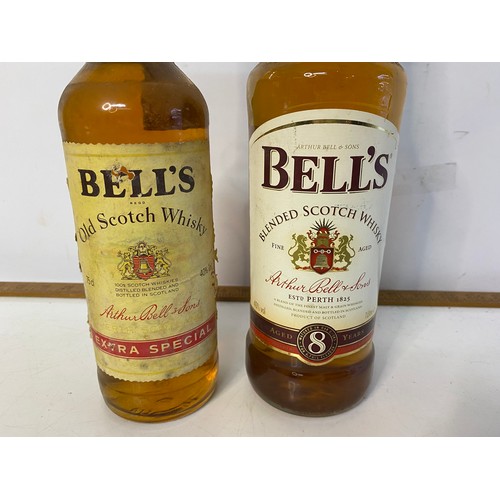 904 - 2 x bottles of Bells whisky, a Bells extra special 75cl bottle and a 1l aged 8 years bottle